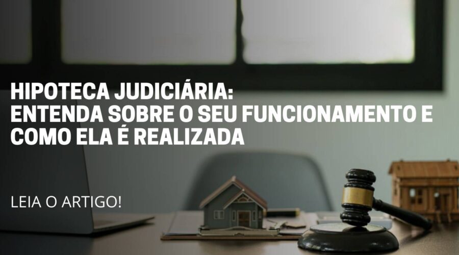 A imagem reflete um mesa de escritório com os itens de advocacia. Título do artigo: Hipoteca judiciária: entenda mais sobre o seu funcionamento